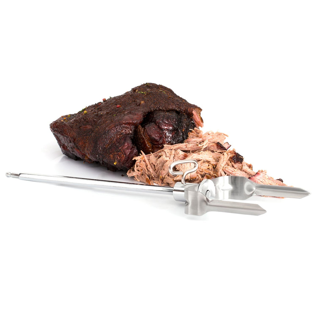 Meat shredder over shredded roast meat, silver prongs with clamp handle.