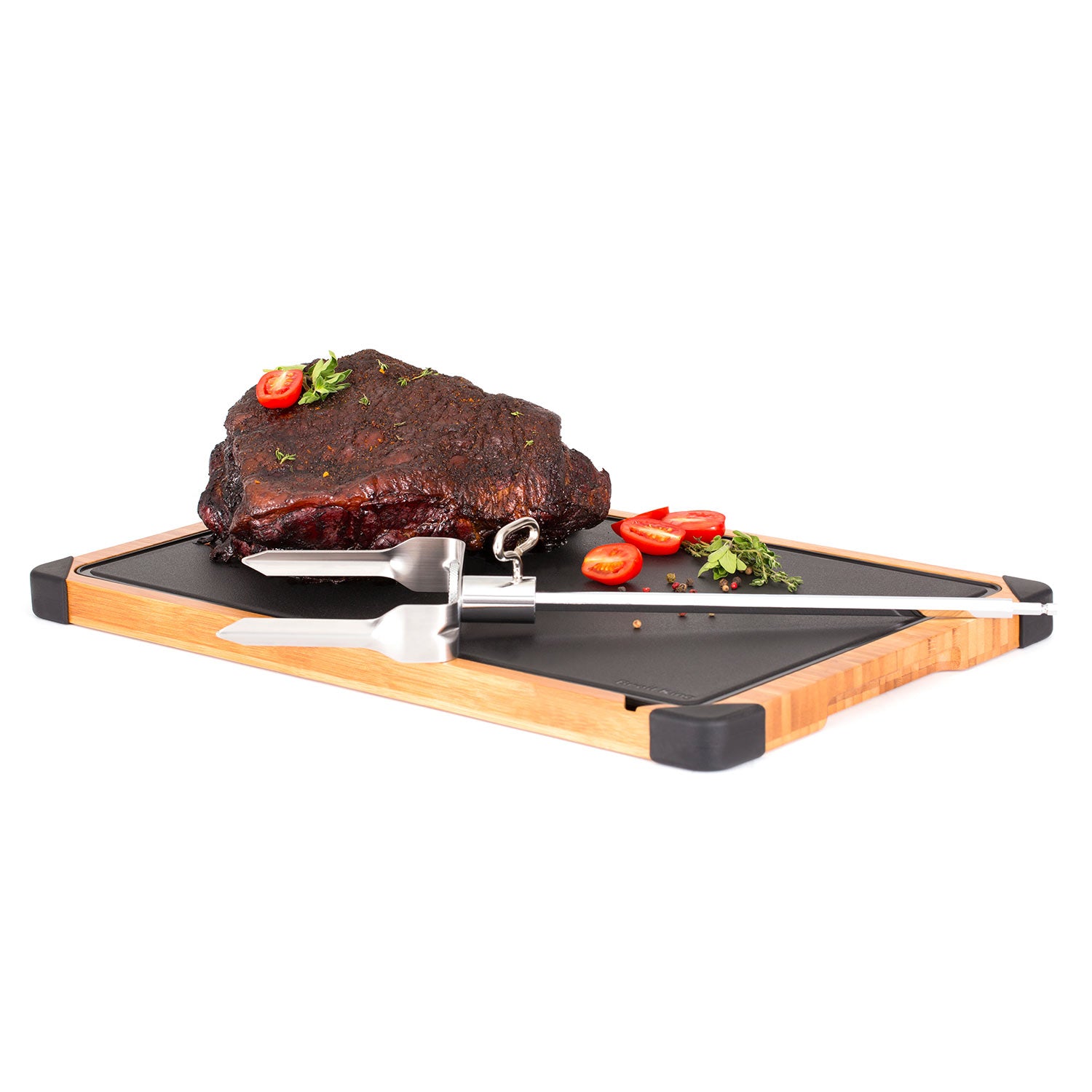 Meat shredder on grill surface beside sliced meat, silver prongs and handle.