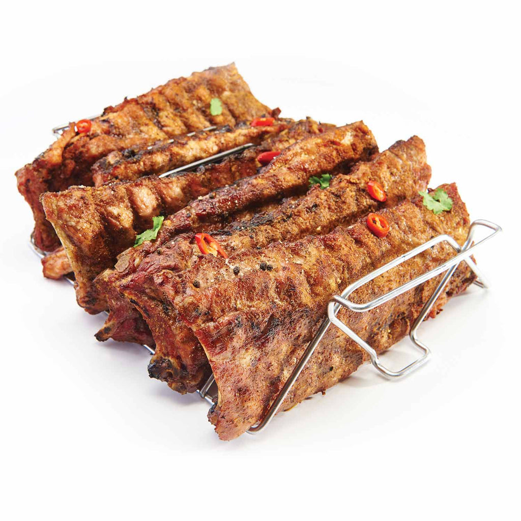 Stainless steel skewer rack holding seasoned meat skewers