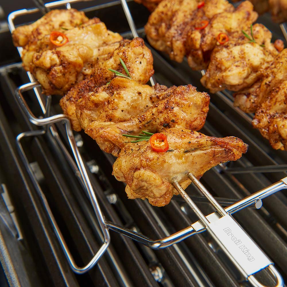 Stainless steel skewer rack with grilled meat skewers and long skewers