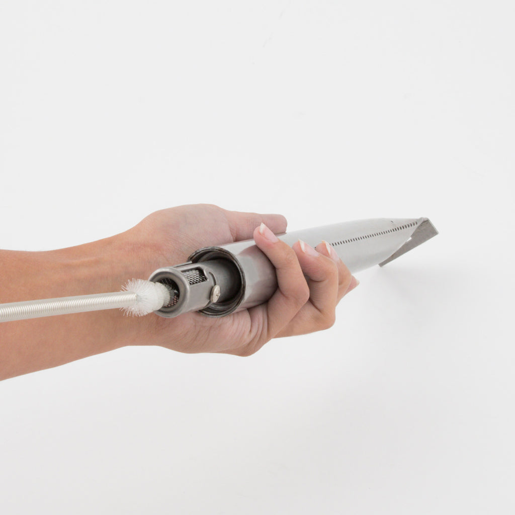 Burner cleaning brush head on a long rod for grill burner maintenance