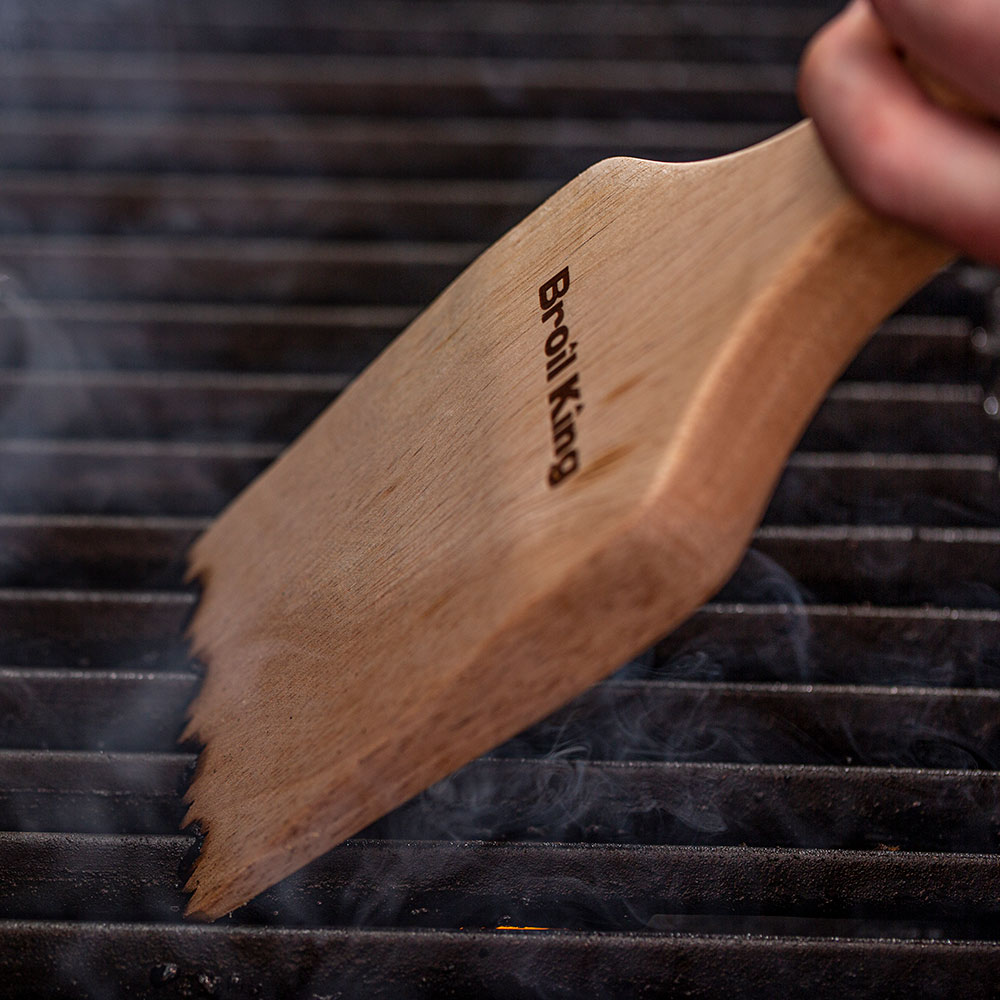 Broil King wood BBQ grill scraper with logo on angled handle and serrated edge