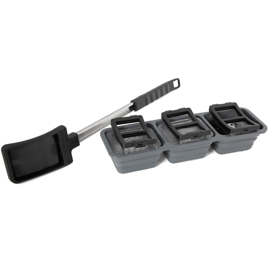 Ice grill brush with stacked gray ice tray blocks and black handle scraper