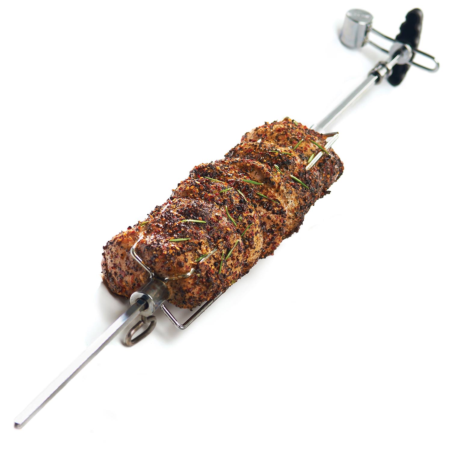 Rotisserie spit holding seasoned meat with metal forks