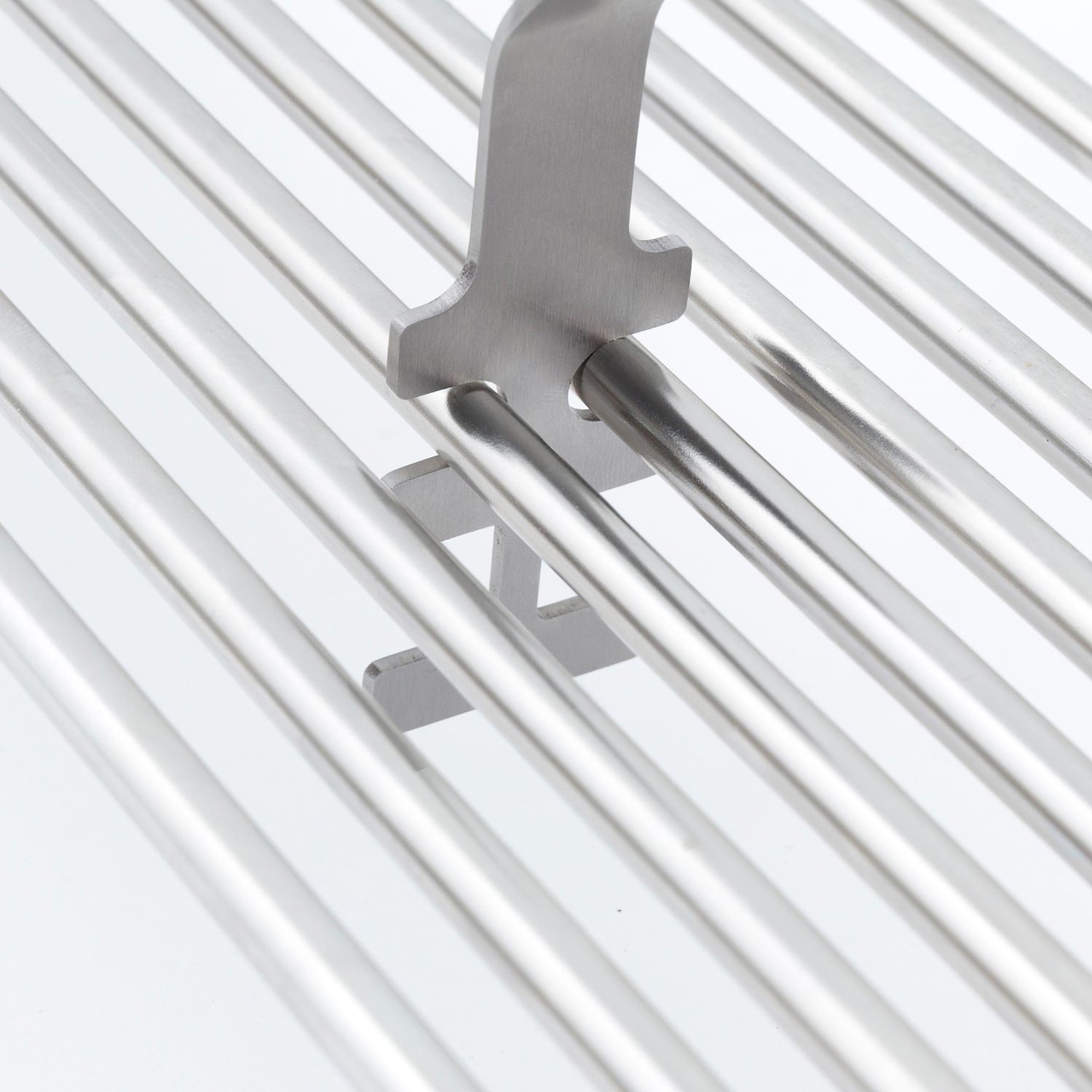 Broil King grid lifter head hooked on white grill grates