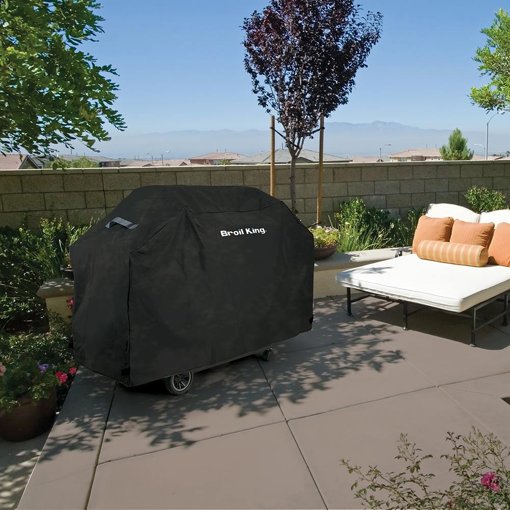 Grill cover for outdoor grill, dark charcoal cover over grill on patio