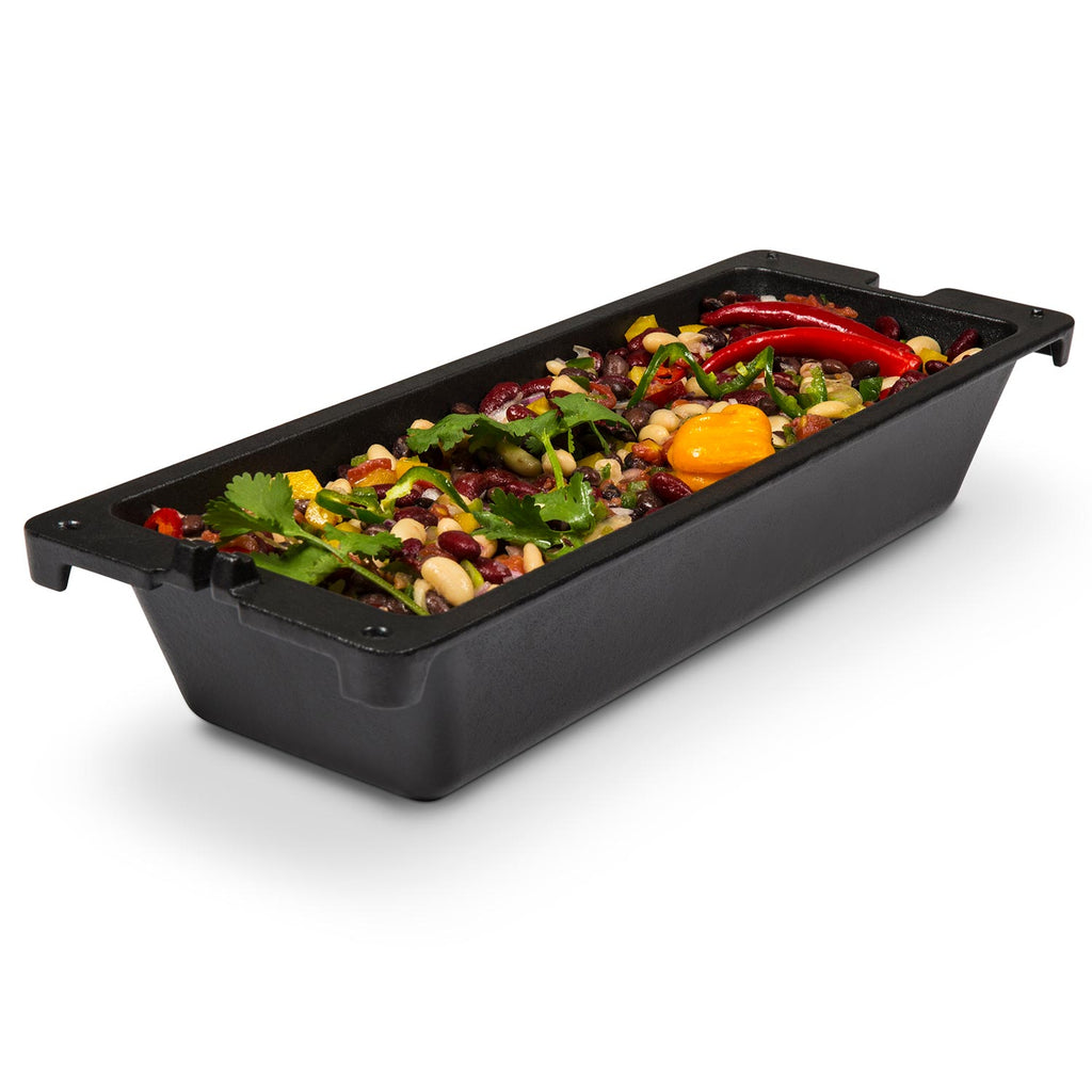 Cast iron wok tray with cooked vegetables and shrimp for grill