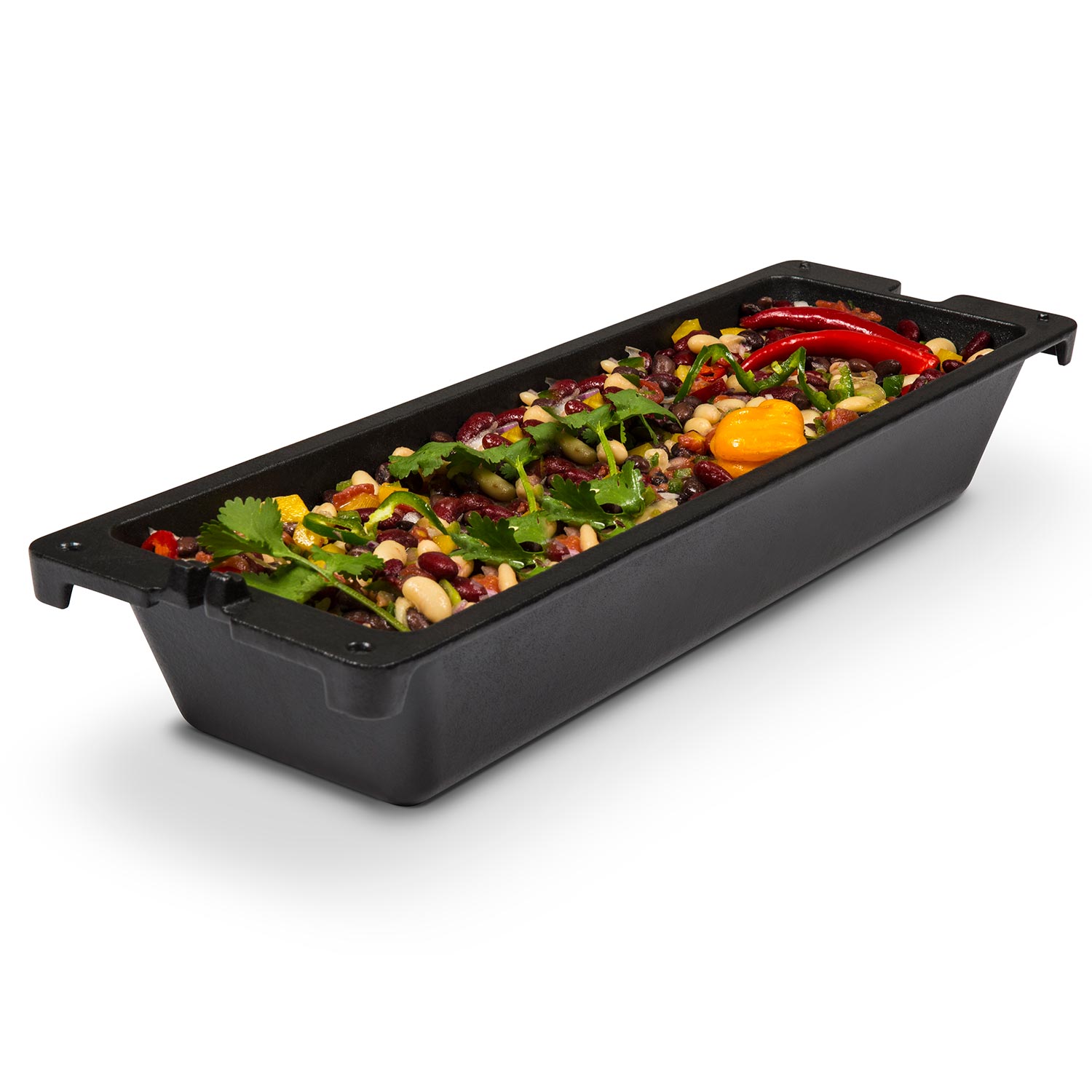 Black cast iron wok tray with side handles, filled with mixed vegetables and eggs
