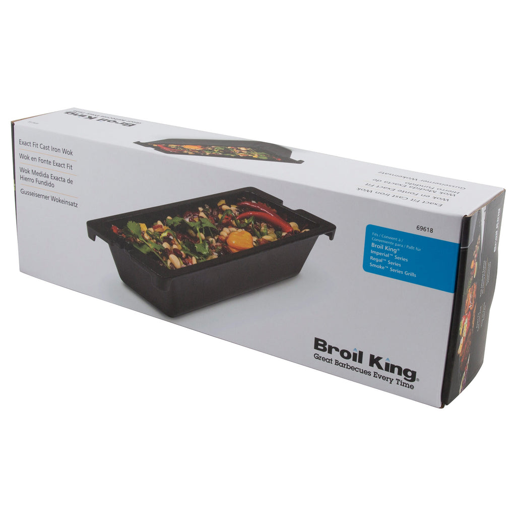 Boxed cast iron wok with product photo on lid, includes accessory info