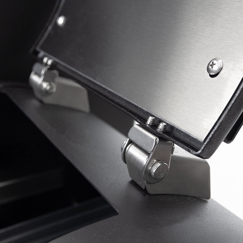 Metal latch and fasteners on the top housing of a dark charcoal offset smoker