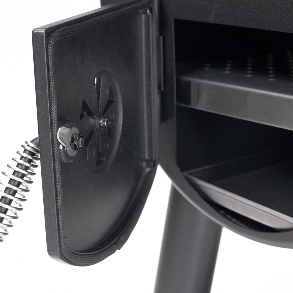 Offset smoker firebox door end with latch plate and visible spring hinge