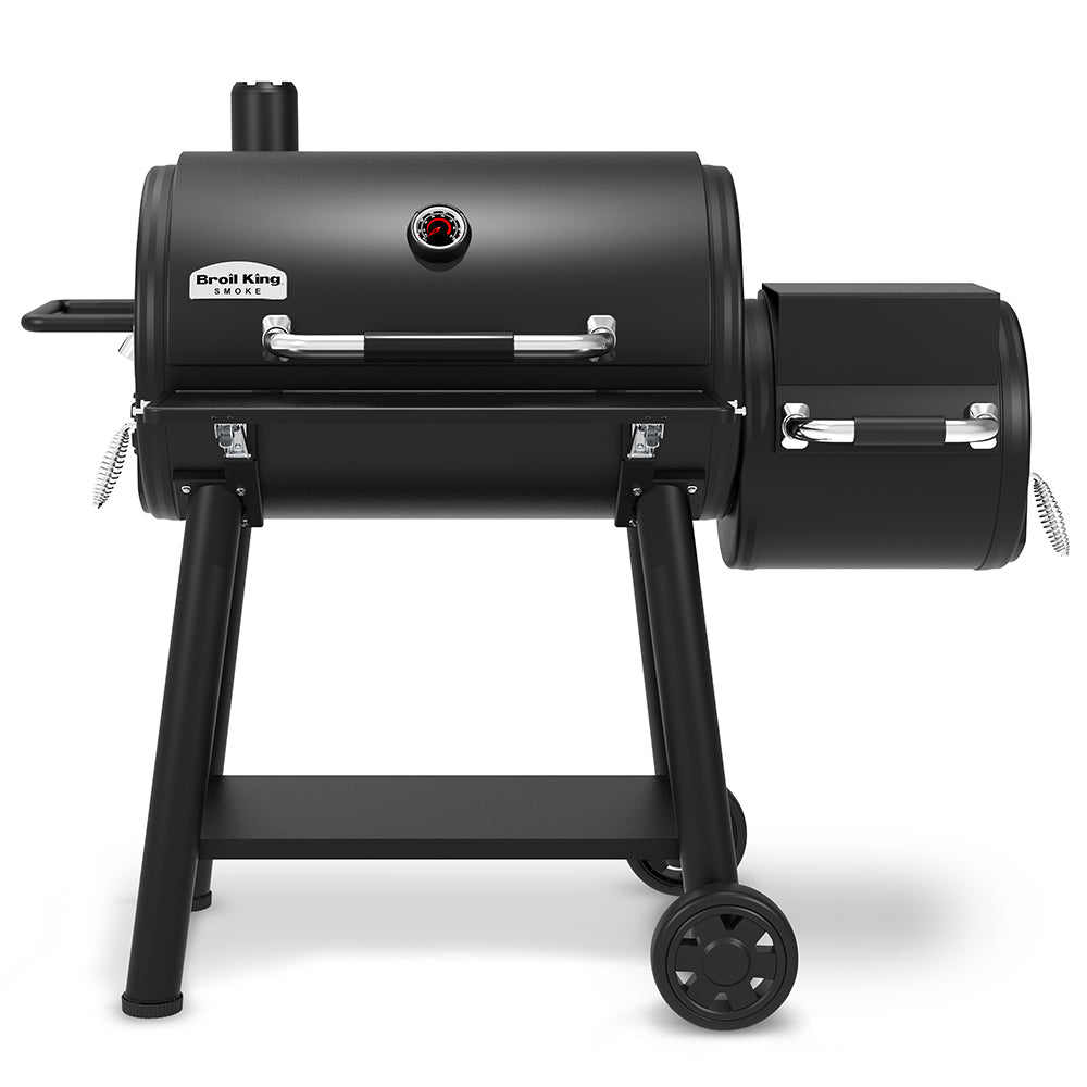 Charcoal offset smoker with side smoke box, black grates, and folding legs