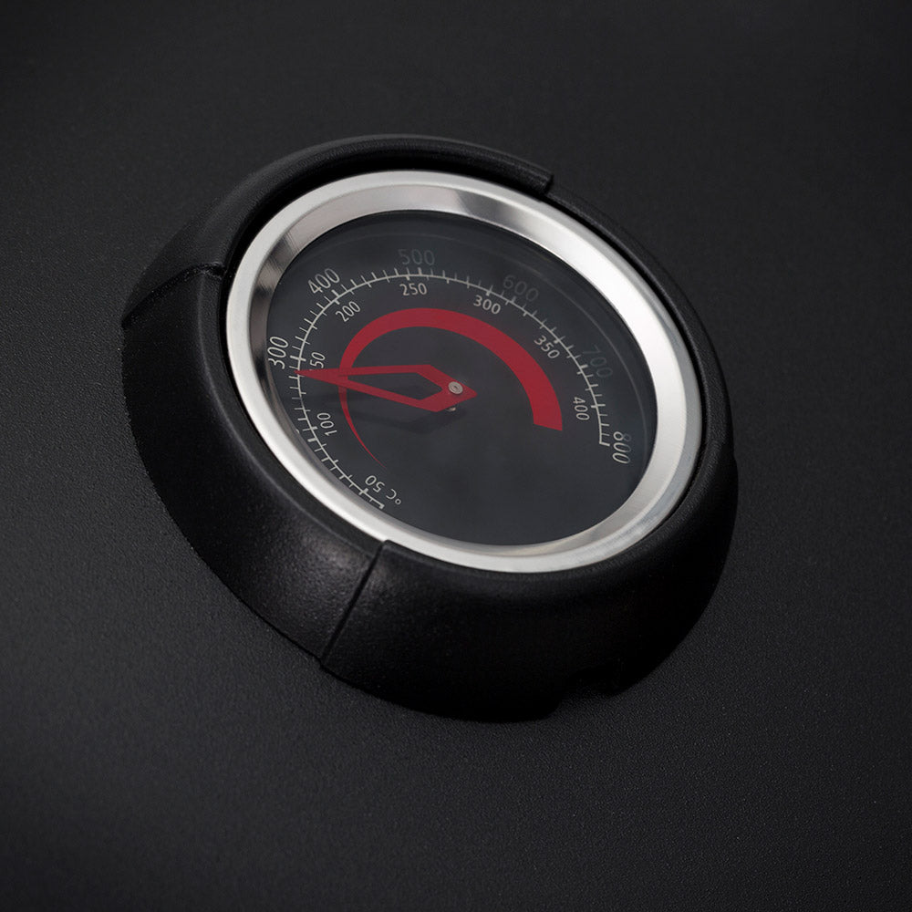Smoker thermometer gauge with red temperature indicator on the hood