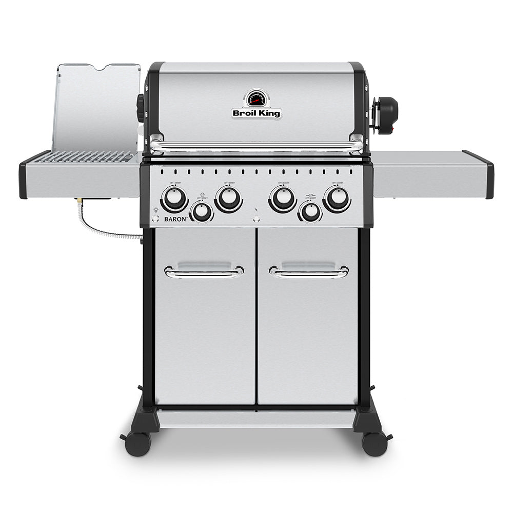 Stainless steel 4-burner gas grill with side shelf panels and front doors