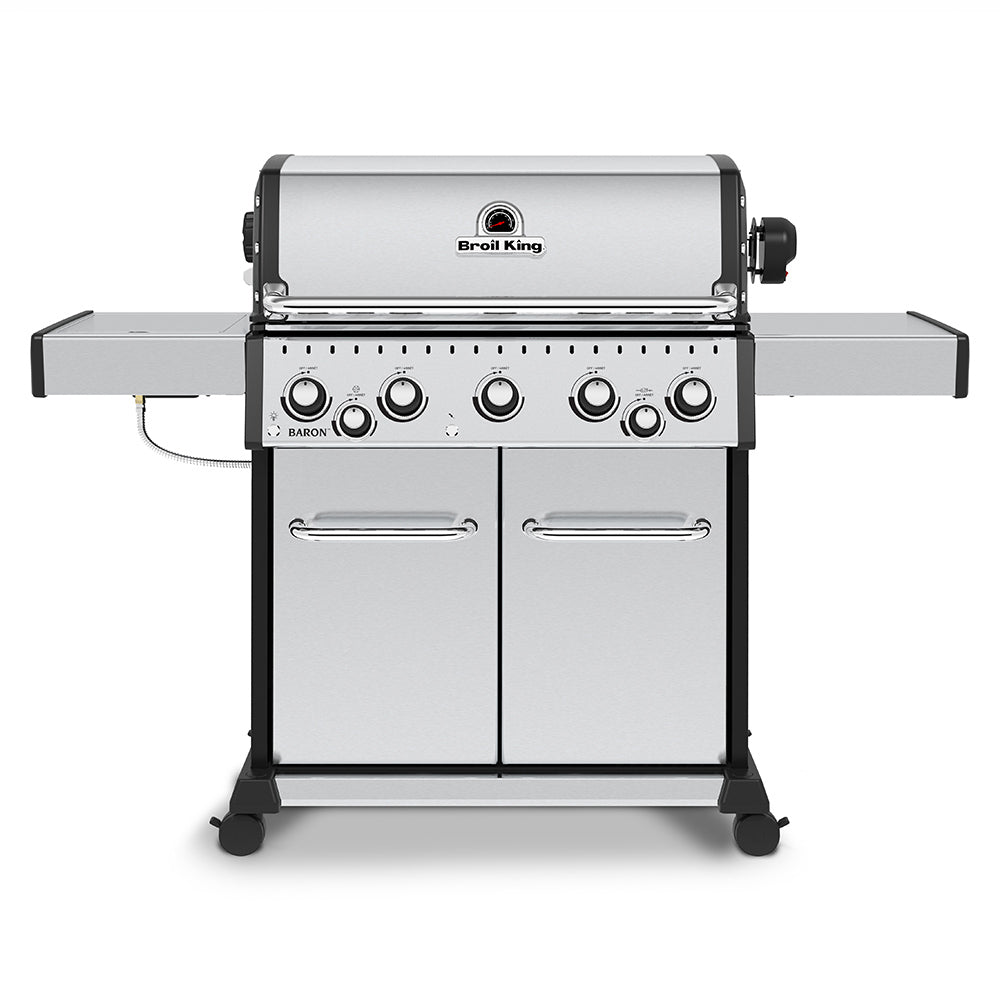Stainless steel 5-burner gas grill with side shelves and control knobs, front view