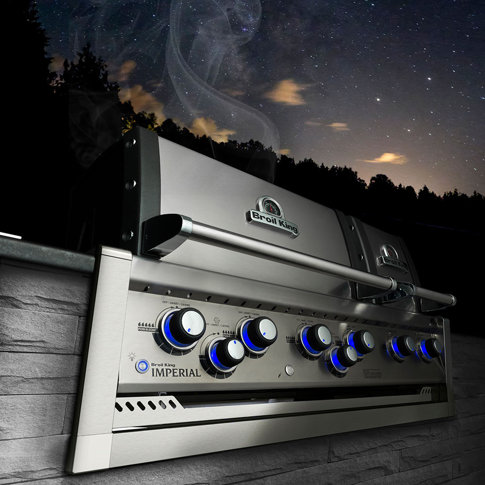 Imperial grill with stainless hood, control knobs, and blue indicator lights