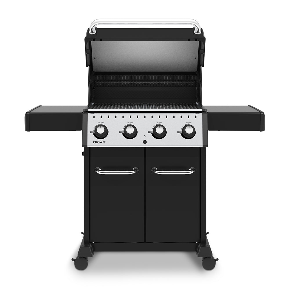 Black 4-burner gas grill with lid open, four control knobs and warming rack