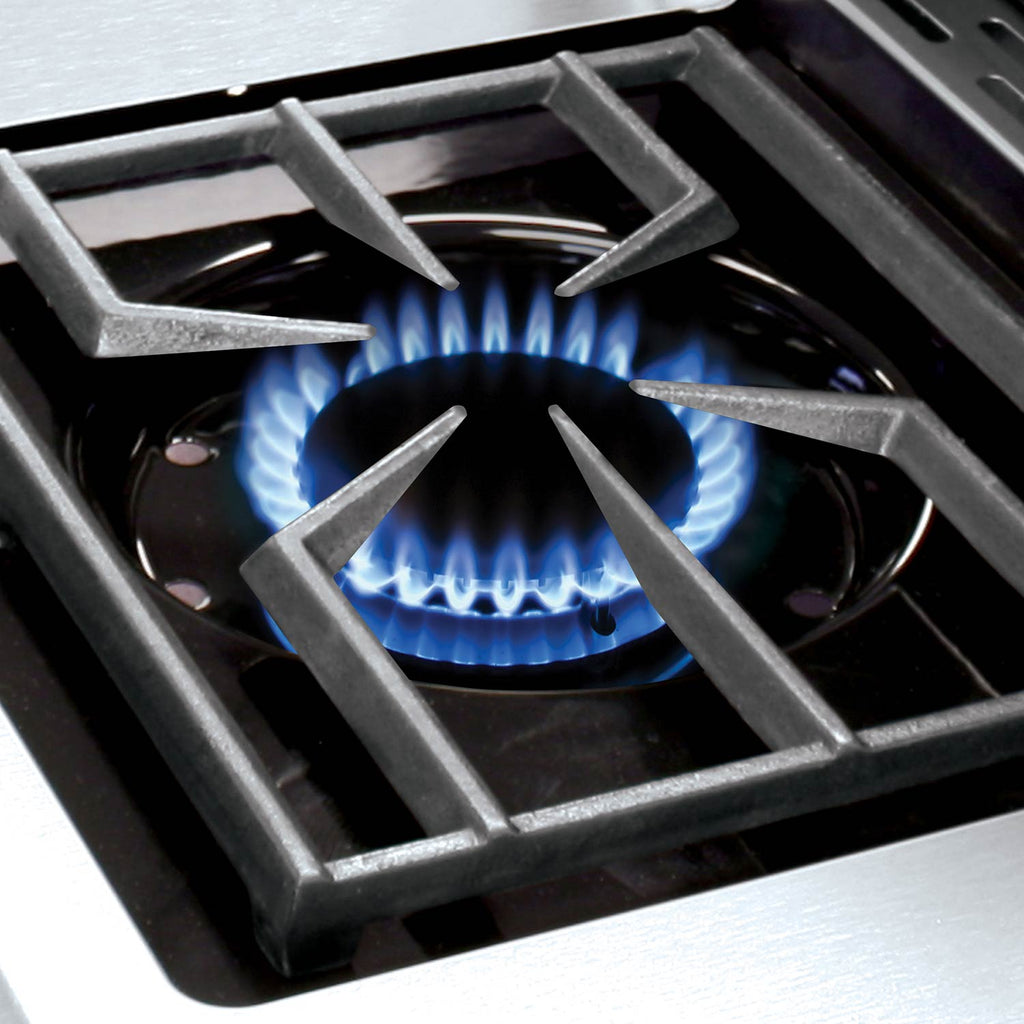 Gas burner grate with blue flames inside grill firebox