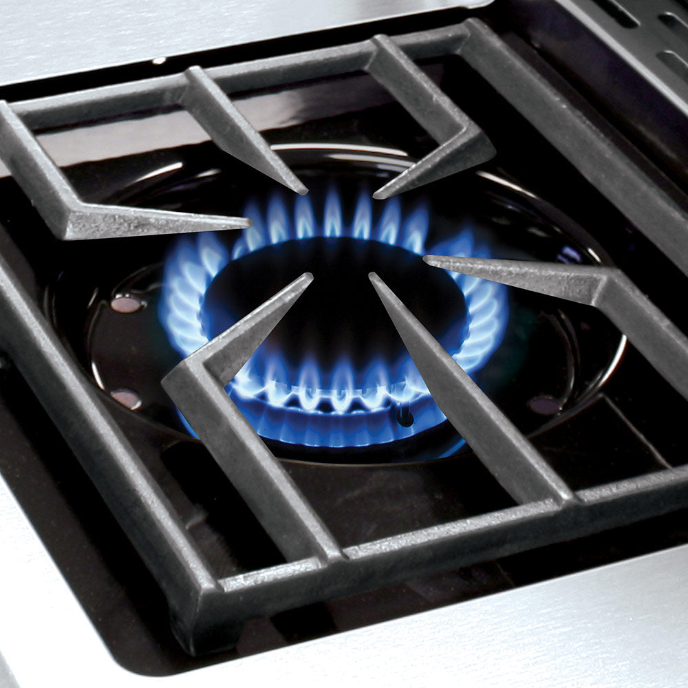 Gas grill burner with blue flame visible through the grate