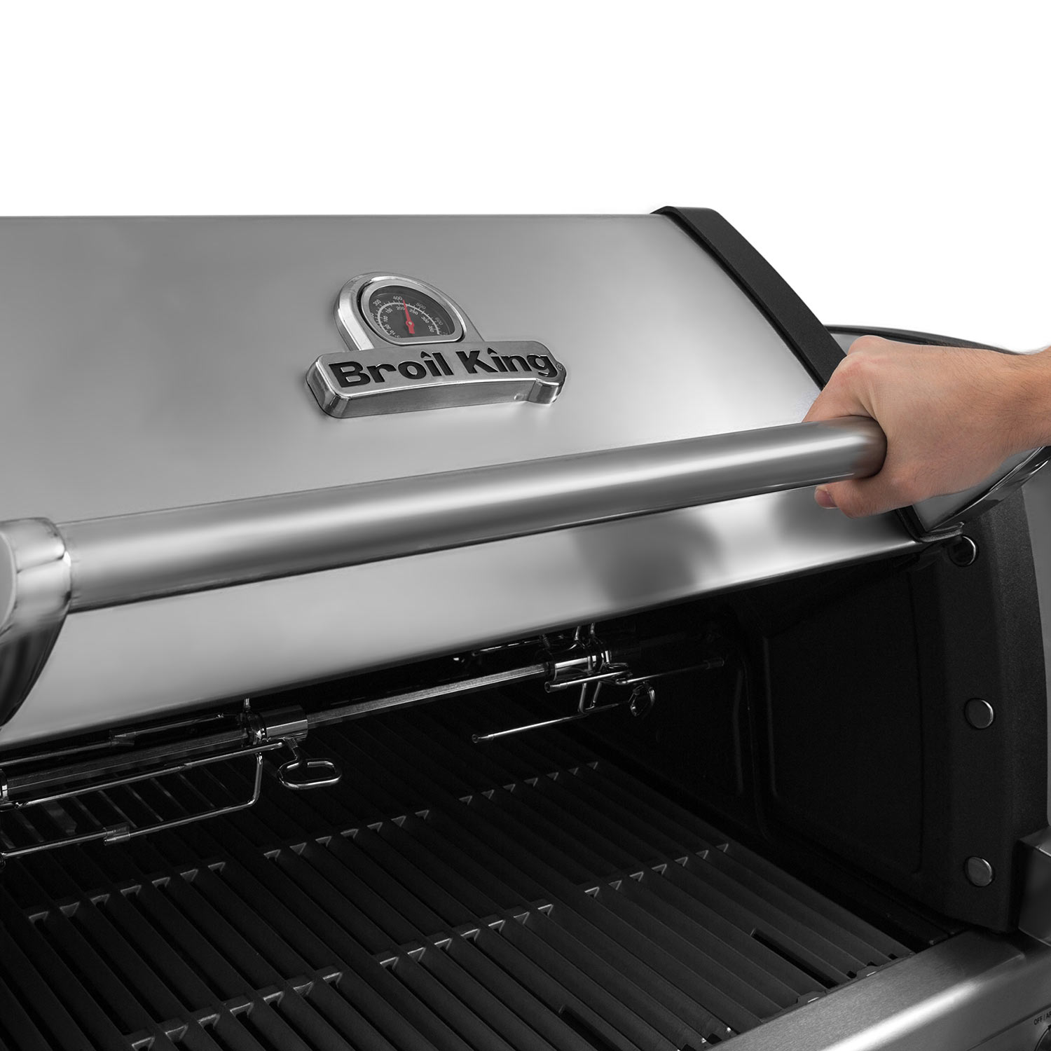 Stainless steel grill lid being opened with a metal handle