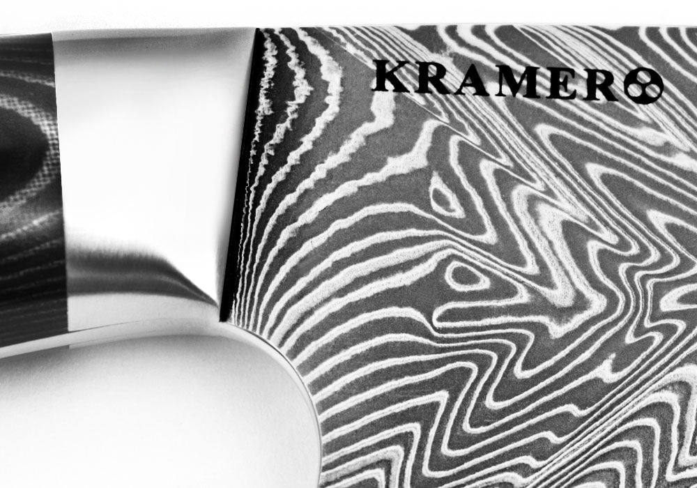Damascus chef's knife blade close-up with KRAMER8 stamp