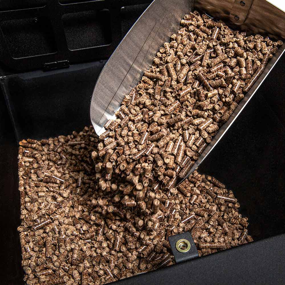 Pellet smoker wood pellets in an open feeder tray