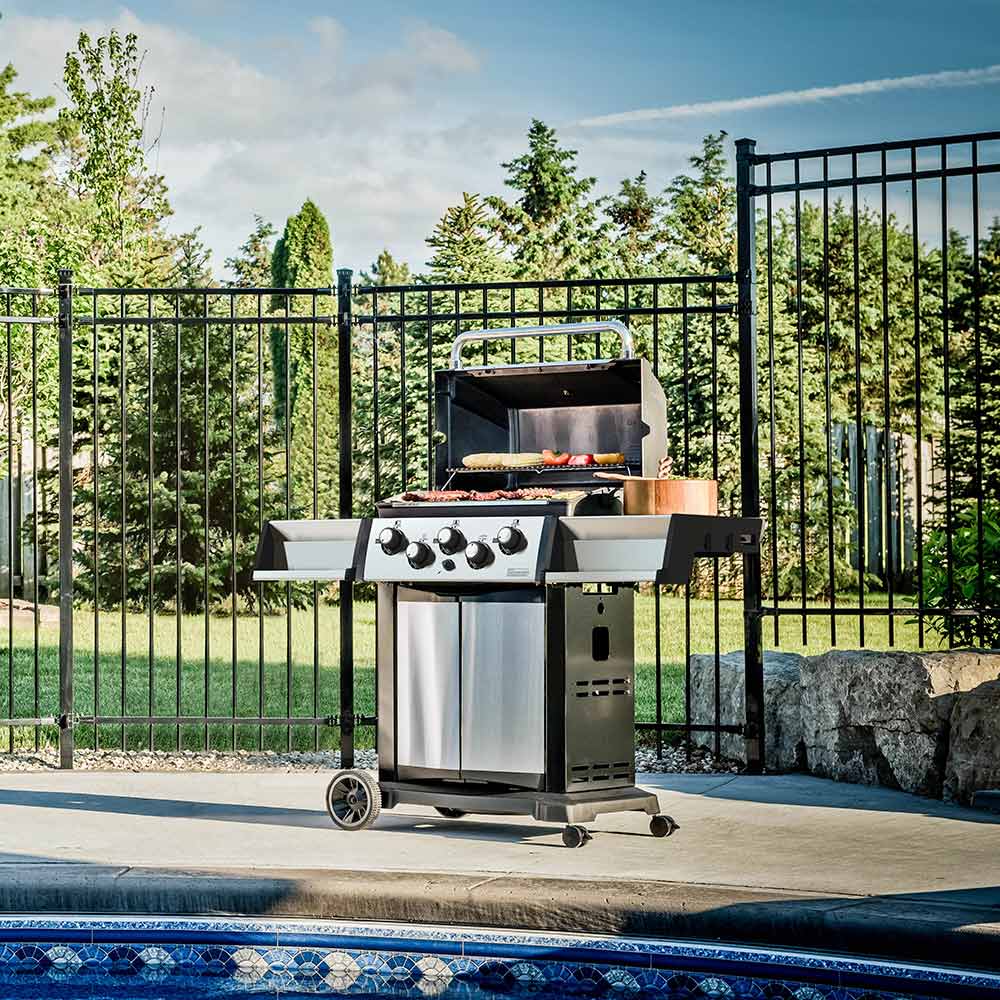 Outdoor gas grill with side cabinet and control panel, black and silver on wheels