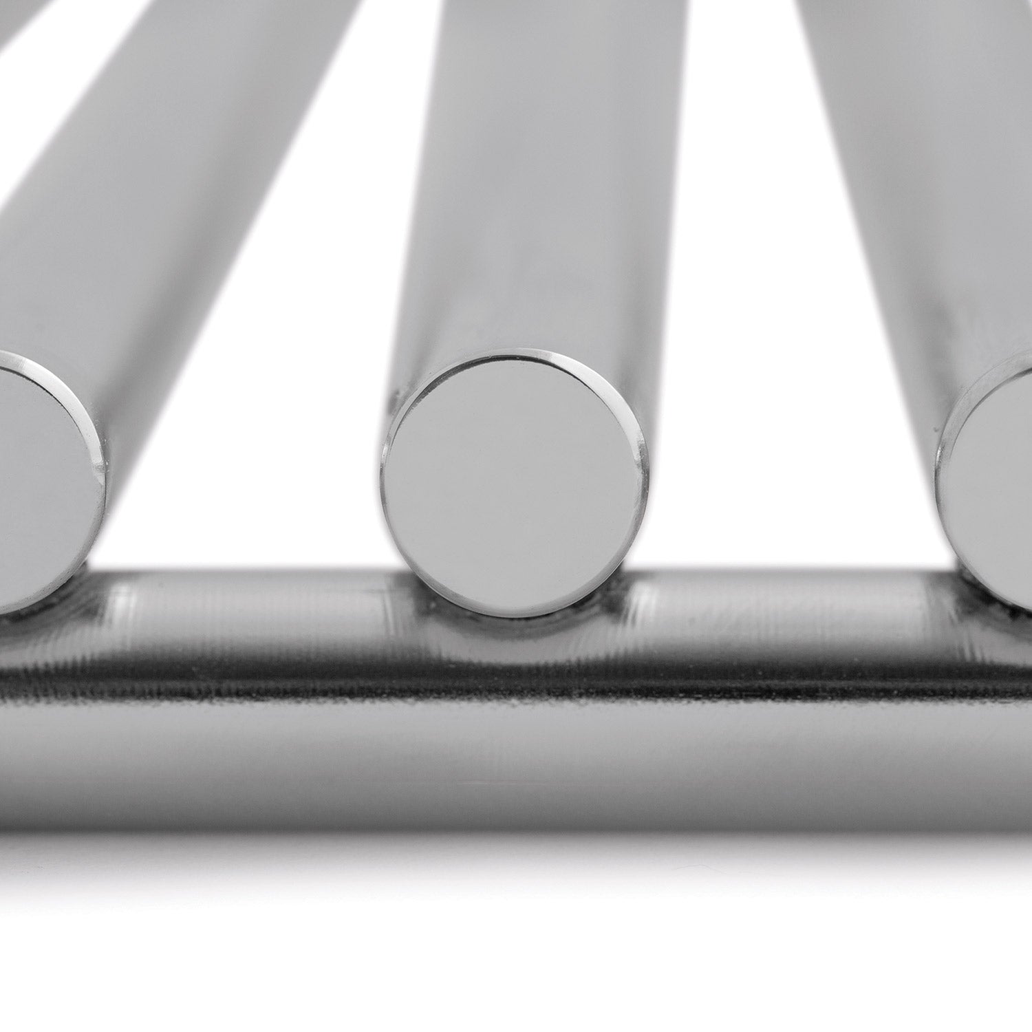 Close-up of stainless steel burner tubes with rounded end caps
