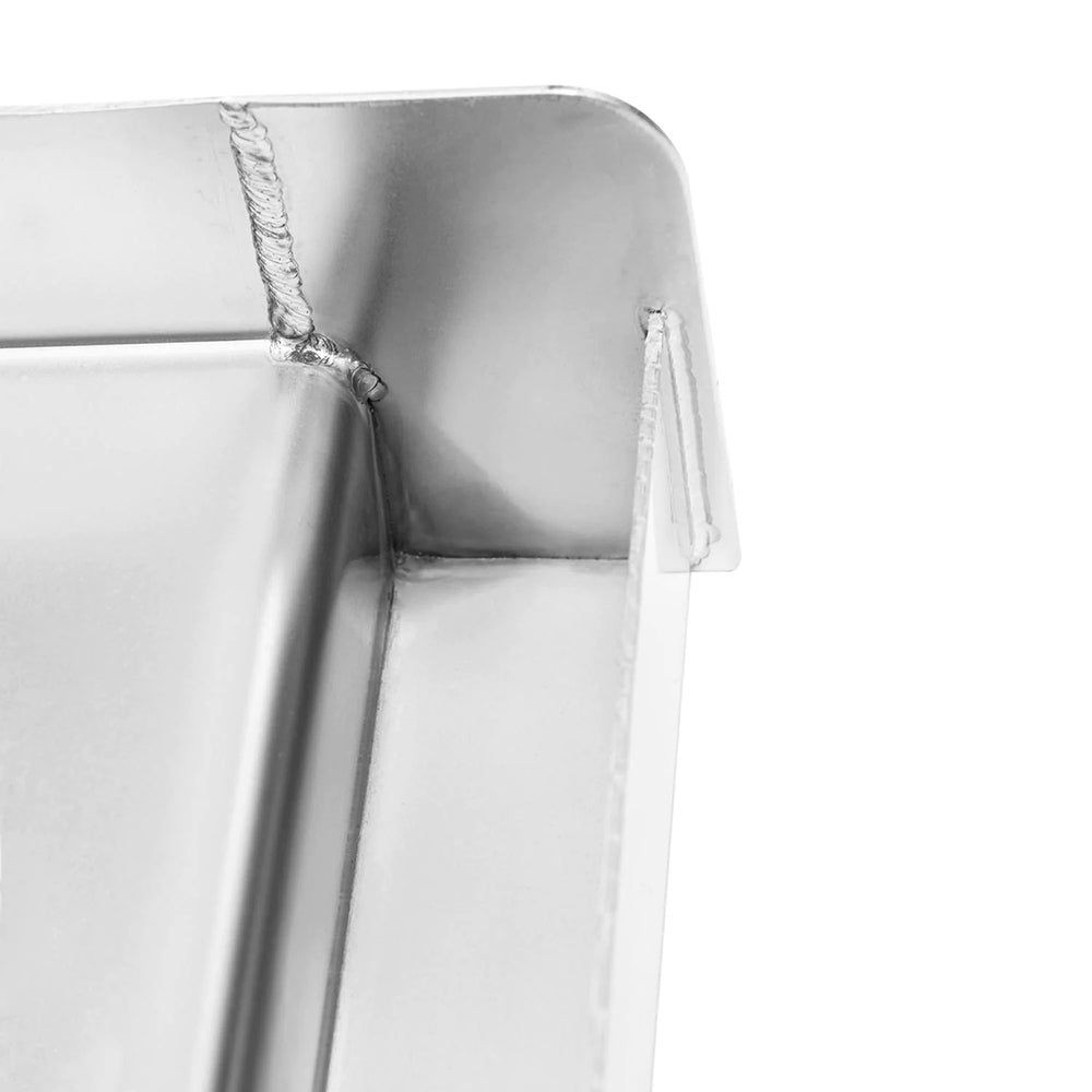 Stainless steel griddle plate corner with reinforced seam and inner wall.