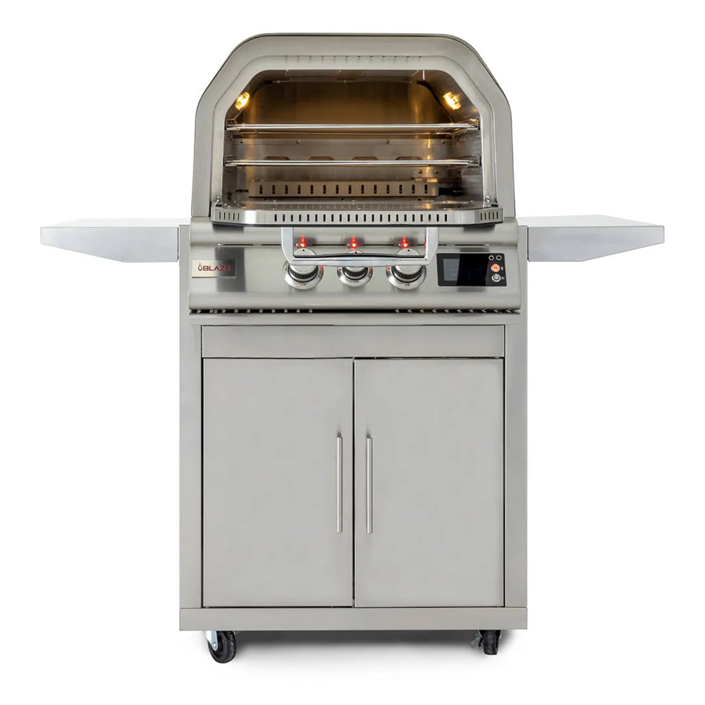 Stainless steel gas pizza oven with illuminated interior and control knobs on cart
