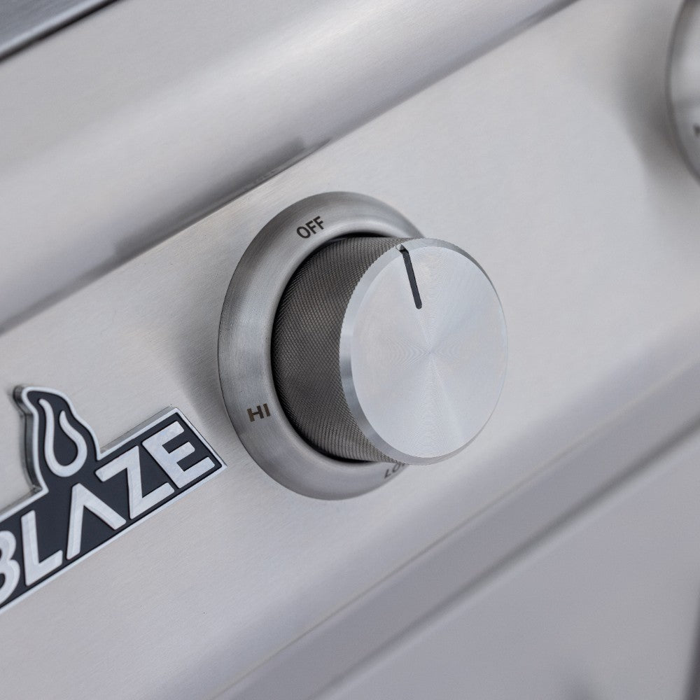 Built-in gas grill control knob with HI and OFF markings on stainless panel
