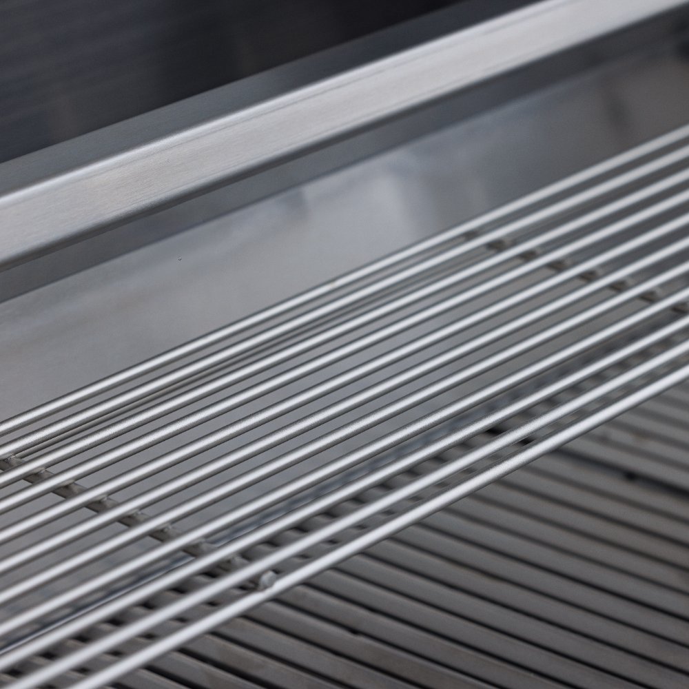 Built-in gas grill cooking grates with parallel stainless bars over burners