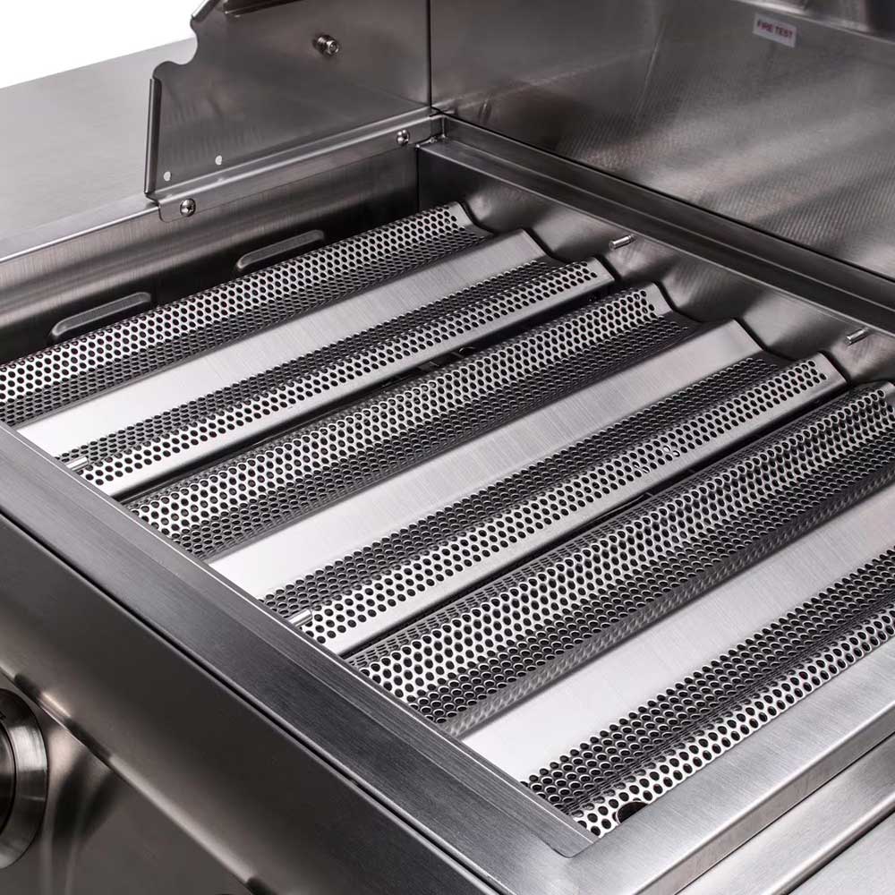 Stainless steel grilling area with perforated heat shield panels and burners
