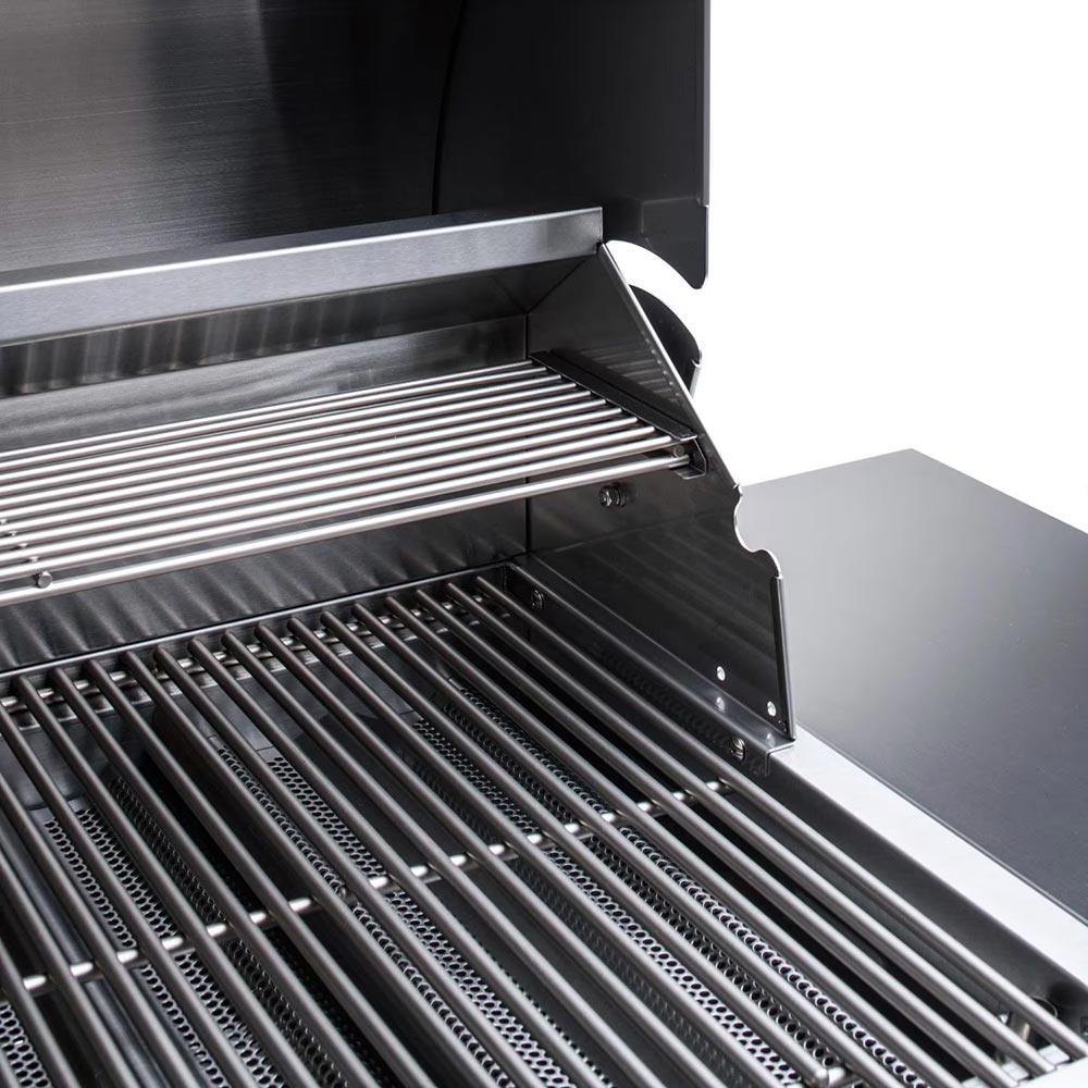 Gas grill with open hood showing striped stainless cooking grates