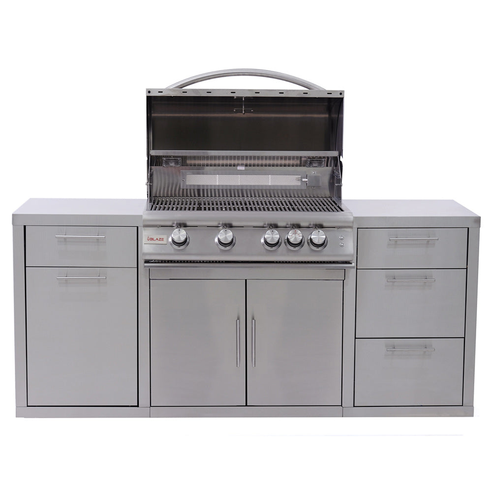 Freestanding stainless gas grill with open lid, warming rack, and multiple control knobs
