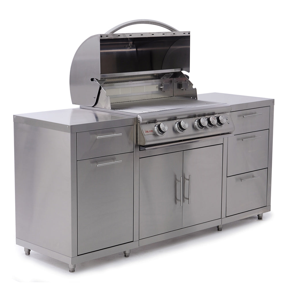 Freestanding stainless gas grill with side burner, open lid, and front cabinet doors
