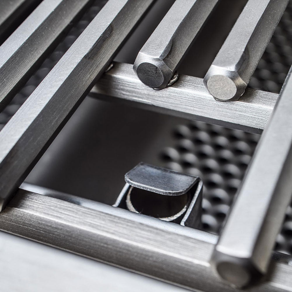 Stainless steel flavorizer bar detail with burner cutout inside grill