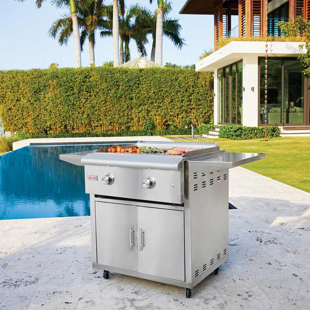 Stainless steel outdoor griddle cart with two control knobs and cabinet doors on casters