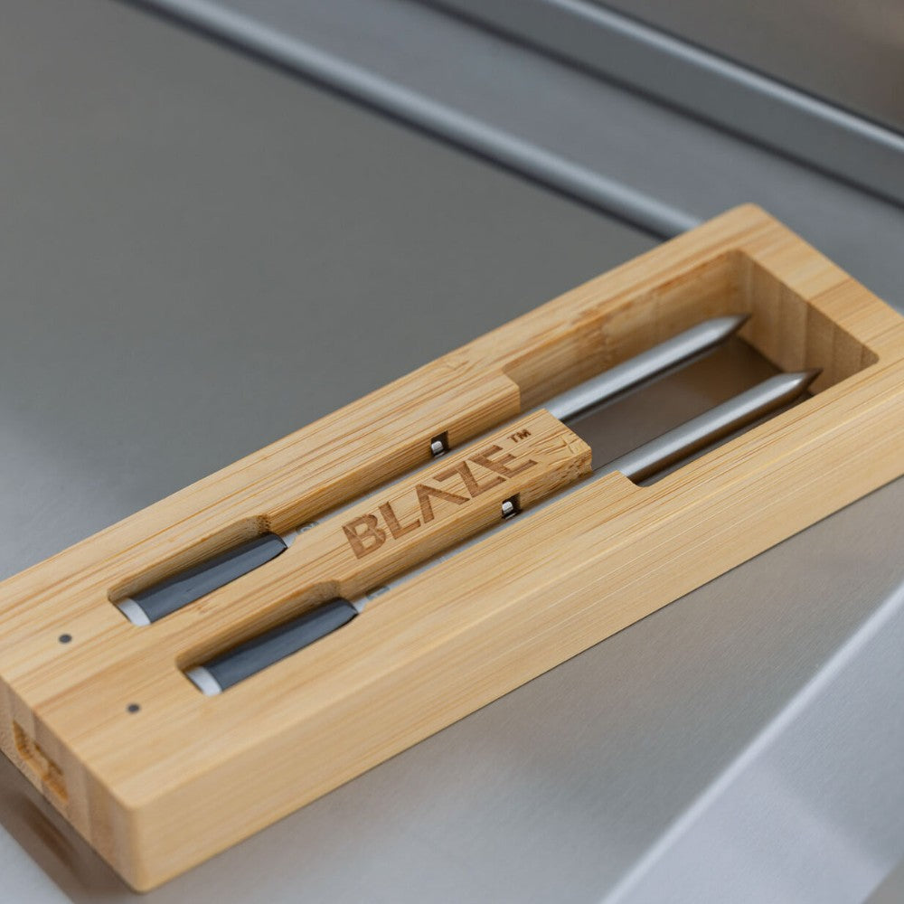 Wooden pizza oven tool tray with two metal utensils and Blaze-branded handles