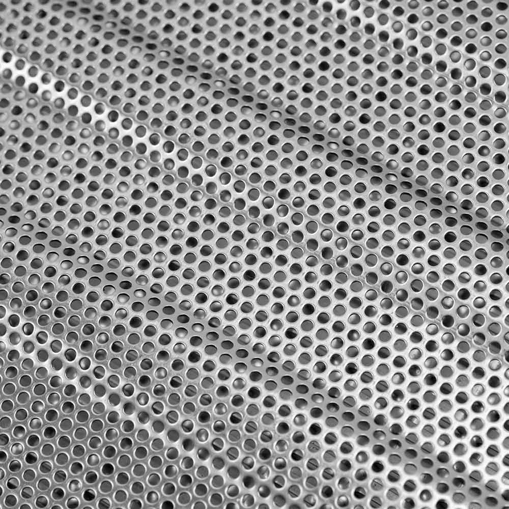 Perforated metal flame tamer insert with circular holes, silver tone.