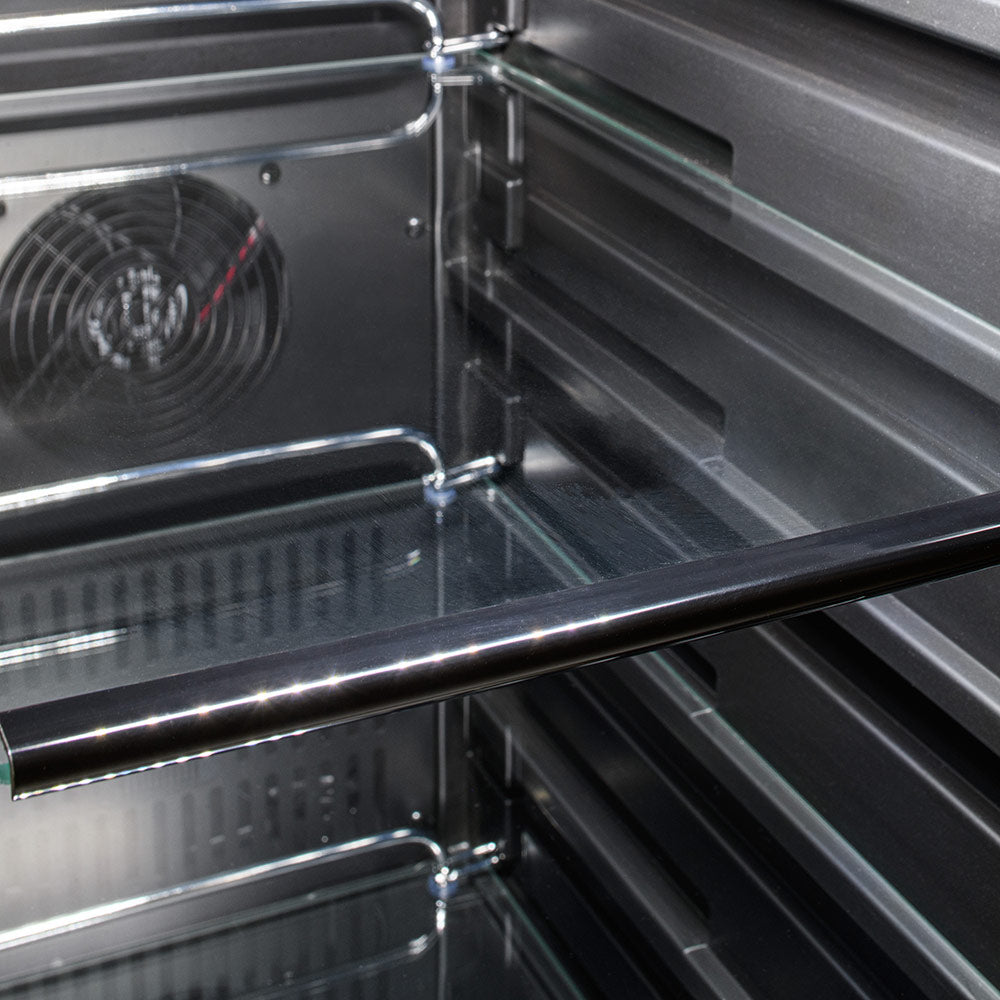 Outdoor stainless refrigerator interior with wire shelves and side vent fan.