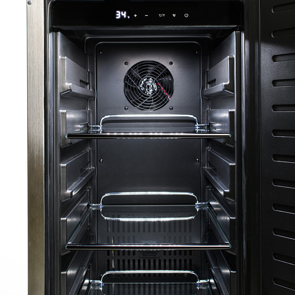 Outdoor stainless refrigerator interior with visible fan, top bar, and three shelves.