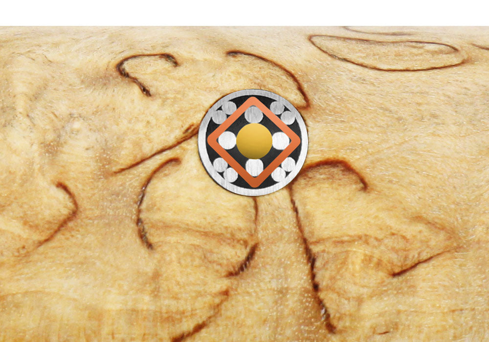 Birchwood knife handle end with metal emblem and decorative inlay
