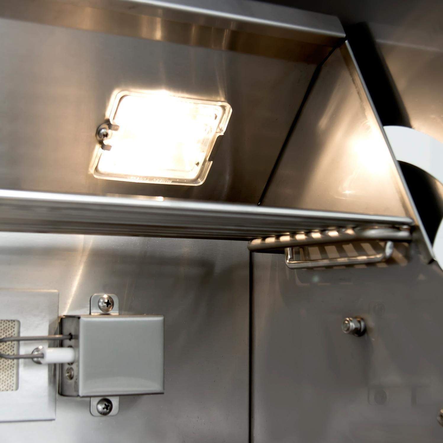 Stainless steel grill hood with interior light, rear controls, and side shelf