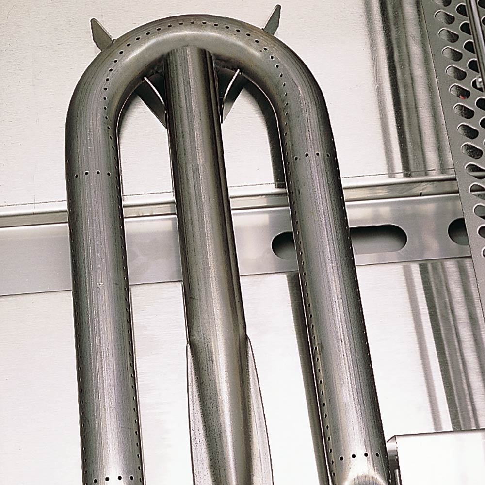 Stainless steel burner tubes inside the grill body