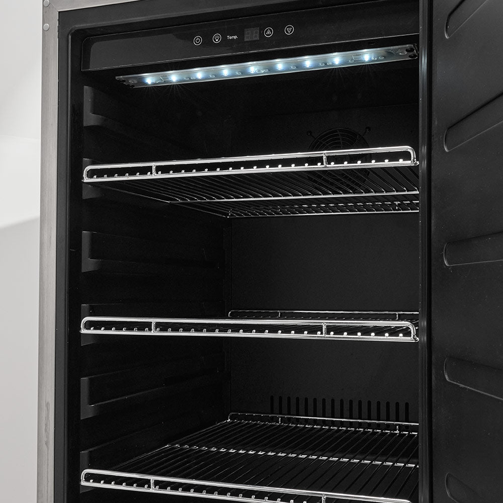 Refrigerator interior with bright LED light and wire shelves behind open door