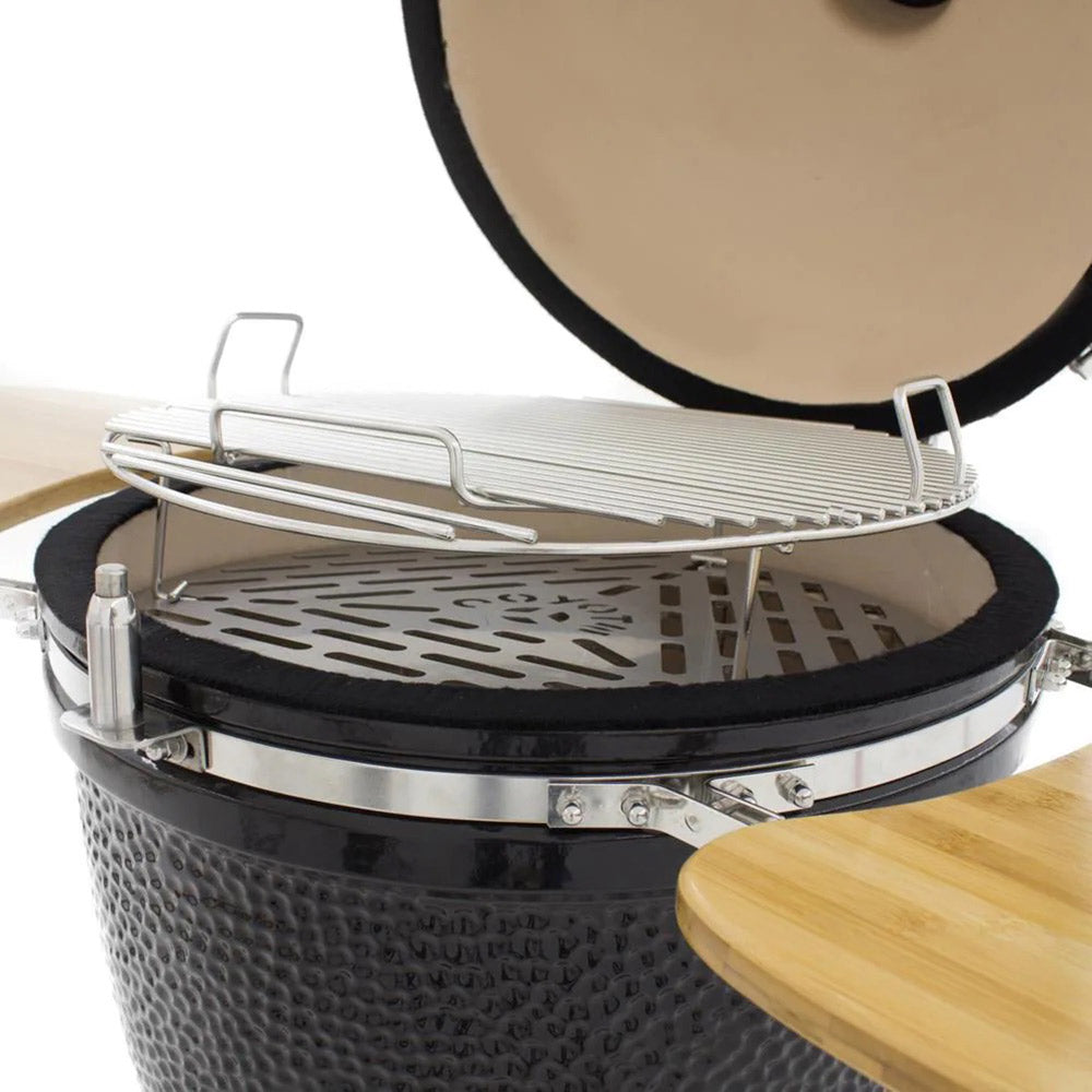 Ceramic asado smoker open with wire cooking grate inside black textured ceramic body
