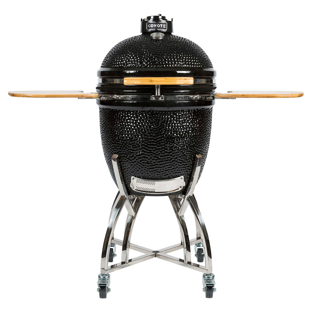 Ceramic asado smoker grill with black dome and wooden side shelf, on wheeled stand