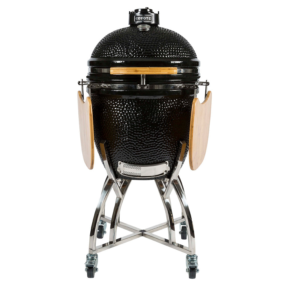 Black ceramic smoker grill with open front, wire stand frame, and wooden side shelves