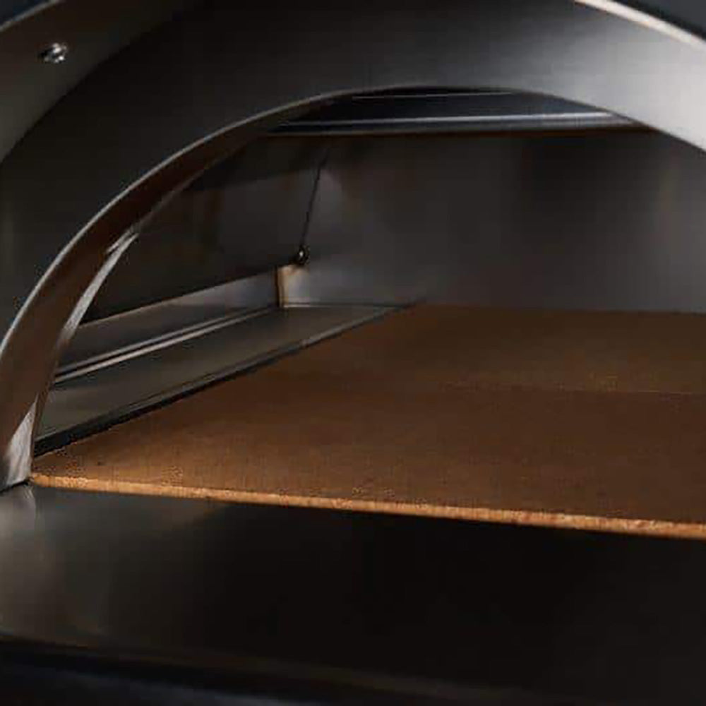 Pizza oven cooking chamber with stainless interior and visible stone baking surface